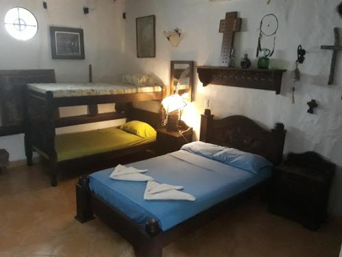 a room with two beds and a lamp in it at Casa Constantino in Rivera