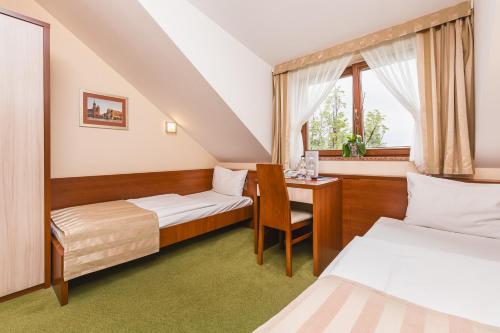 Posteľ alebo postele v izbe v ubytovaní Domus Mater Hotel
