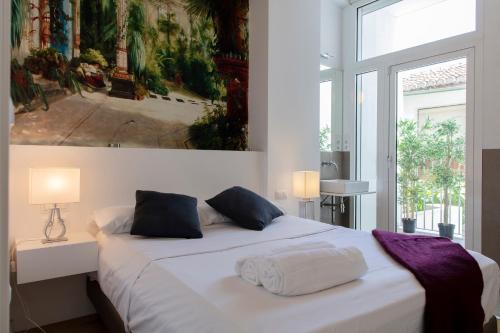 Postel nebo postele na pokoji v ubytování FLORIT FLATS - Serranos Apartment