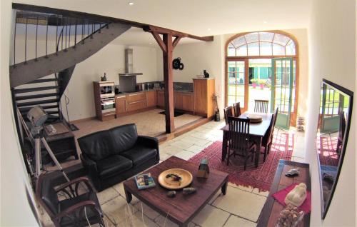 a living room with a couch and a table at La Closeraie in Noyers-sur-Cher