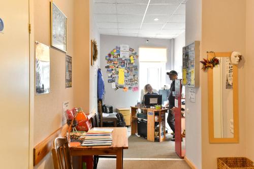 an office with a person working at a desk at Central Hostel in Riga
