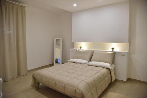 Un pat sau paturi într-o cameră la Maison Veronique