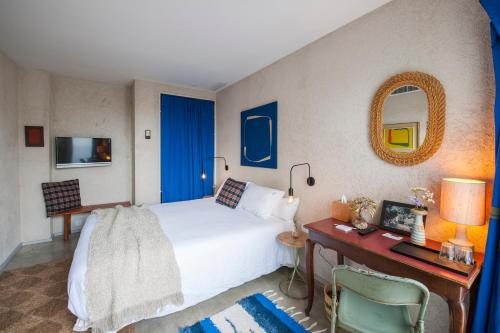 Postel nebo postele na pokoji v ubytování Kook Hotel Tarifa