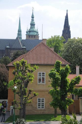 a building with two trees in front of it at Flamingo Apartments in Prague