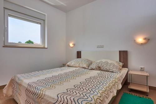 Postel nebo postele na pokoji v ubytování Apartmani B&B