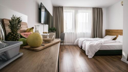 a bedroom with a bed and a kitchen with a sink at The Mint Villa - Saint Vlas in Sveti Vlas