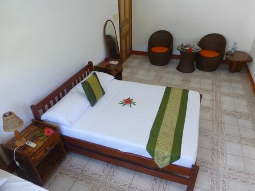 Ein Bett oder Betten in einem Zimmer der Unterkunft Zerof Guest House