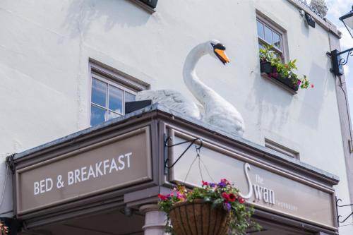 a statue of a swan on top of a building at The Swan in Thornbury