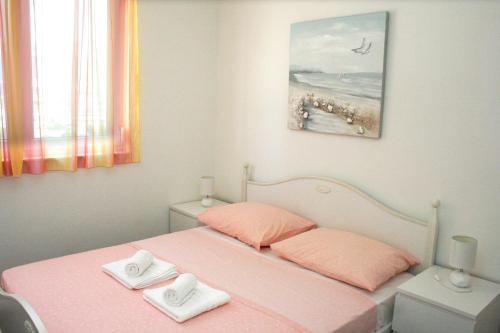 Postel nebo postele na pokoji v ubytování Apartment MEL II