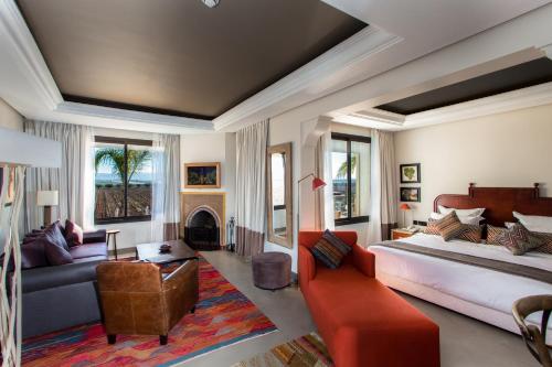 a large living room with a bed and a couch at Château Roslane Boutique hôtel & Spa in Meknès