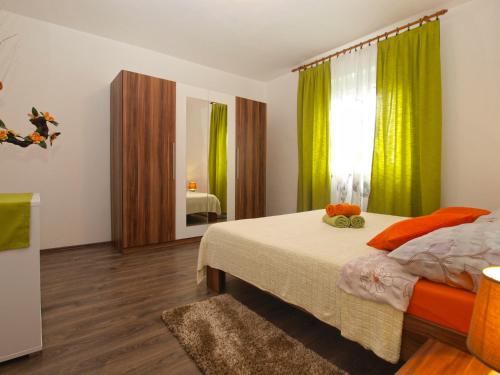 Postel nebo postele na pokoji v ubytování Apartment Luciano 1540