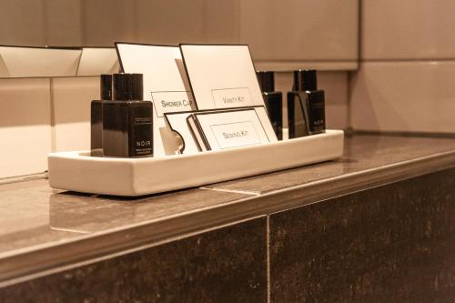 a counter with a tray of products on it at Royal Hotel - Urban Living in Basel