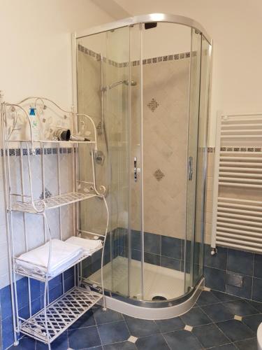 a shower in a bathroom with a glass shower stall at Sweet in Chianti in Tavarnelle Val di Pesa