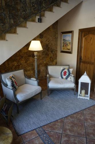 a living room filled with furniture and a fire place at Hostal La Posada in Torrellano