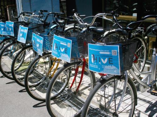 a row of bicycles parked next to each other at Osaka Guesthouse HIVE in Osaka