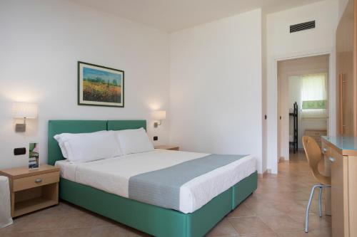 Postel nebo postele na pokoji v ubytování Cormoran Hotel