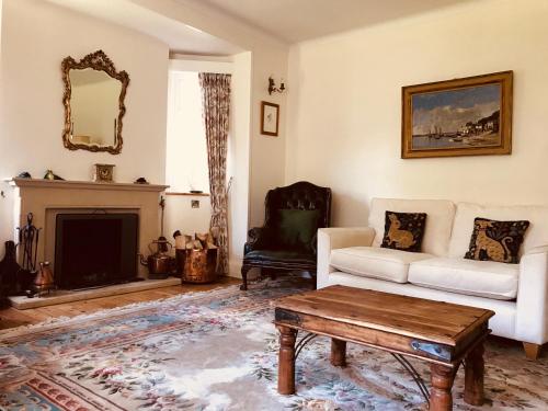 a living room with a couch and a coffee table at Tresillian House in Melton Mowbray