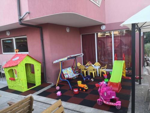 a house with a play area with toys in it at Свети Кирил Лозенец in Lozenets
