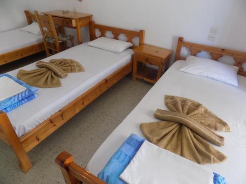 Postel nebo postele na pokoji v ubytování Pension Dimitra
