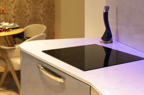 a kitchen with a counter with a vase on it at Dönhoff Residence in Pärnu