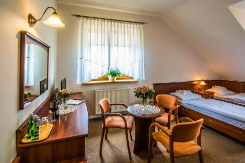 Postel nebo postele na pokoji v ubytování Gościniec Na Rozdrożu