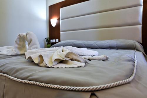 Ένα ή περισσότερα κρεβάτια σε δωμάτιο στο Marathon Hotel - All Inclusive
