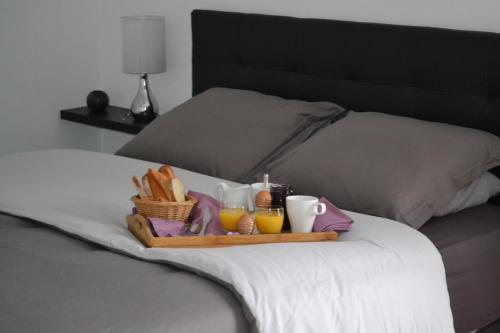 מיטה או מיטות בחדר ב-Le Paddock des Caloges