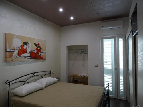 Postel nebo postele na pokoji v ubytování Nonna Ia B&B