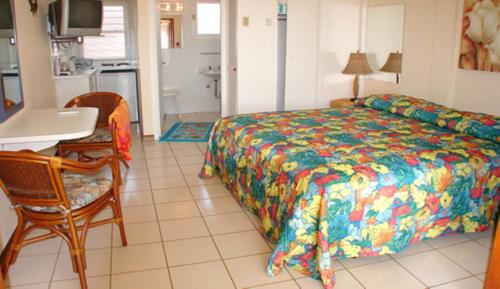 Ένα ή περισσότερα κρεβάτια σε δωμάτιο στο Aruba Beach Villas