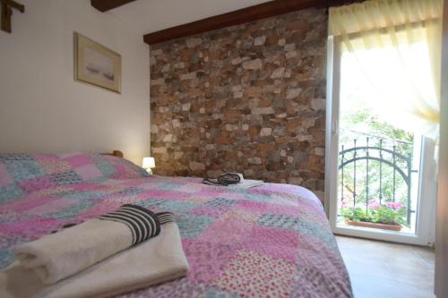 Ένα ή περισσότερα κρεβάτια σε δωμάτιο στο Apartments Neven