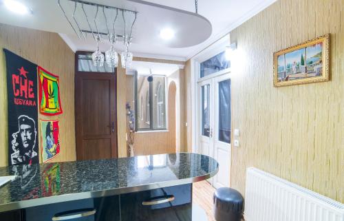 a kitchen with a black counter top in a room at Anastasia Guesthouse in Borjomi