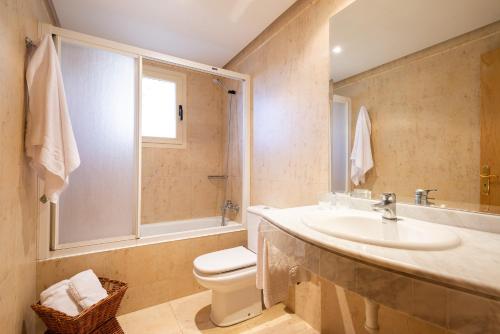 a bathroom with a sink and a toilet at Paz y Mar, Santa Ponsa in Santa Ponsa