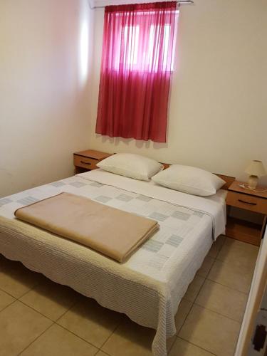 Katil atau katil-katil dalam bilik di Apartments Viganj