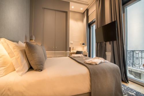 Katil atau katil-katil dalam bilik di Hotel da Baixa