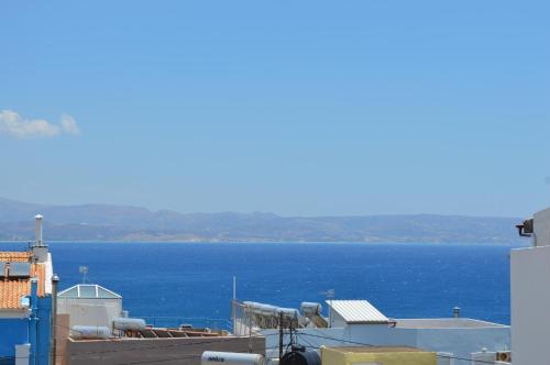a view of the ocean from a building at Rozmari and Spa in Agia Galini
