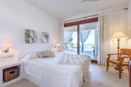 Кровать или кровати в номере Villa Can Azul