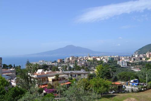 a view of a city with mountains in the background at Villa Aurora in Vico Equense