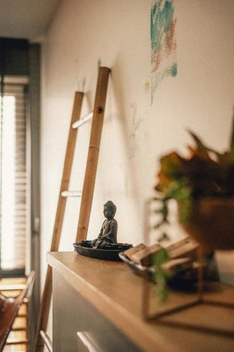 a small figurine sitting on top of a counter at 36 Phô Cô Hotel & Suites in Weimar