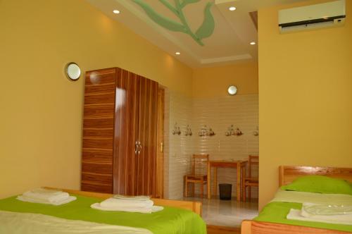 Postel nebo postele na pokoji v ubytování Kobuleti Pines Resort
