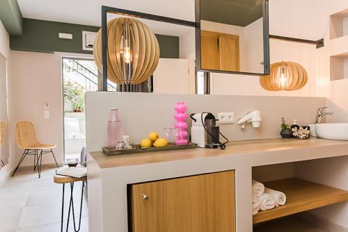 a kitchen with a counter with fruits on it at Sunshine Boutique Hotel by Estia in Malia