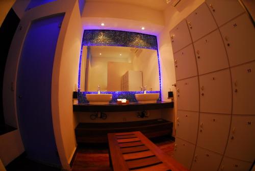 a bathroom with two sinks and a mirror at Casa Cupula LGBT Luxury Resort in Puerto Vallarta