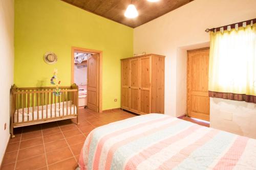 Ένα ή περισσότερα κρεβάτια σε δωμάτιο στο Casa Mi Tio Perico