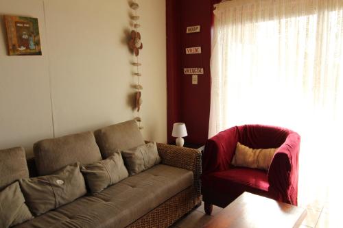 a living room with a couch and a chair at Seeskulp 10 in Margate