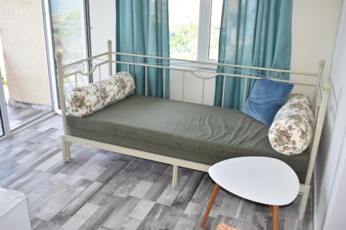 a bunk bed in a room with a window at Синя луна in Lozenets