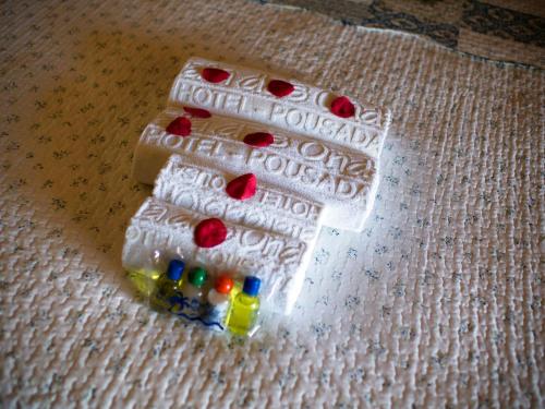 a group of pills in a plastic packet on a blanket at Pousada Praia das Ondas - Pé na areia in Itacimirim