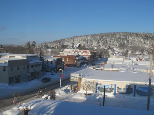 an aerial view of a snow covered parking lot at Le Voyageur Inn in Mattawa