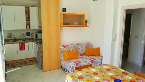 a kitchen with a table and a chair in a kitchen at Amalfi Coast Houses in Atrani