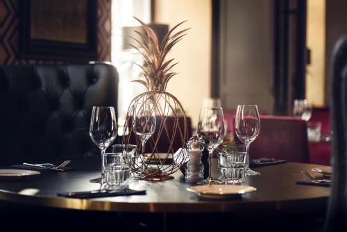 a table with wine glasses on top of it at Statt Hassleholm BW Signature Collection in Hässleholm