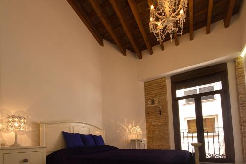 A bed or beds in a room at Total Valencia Elegance