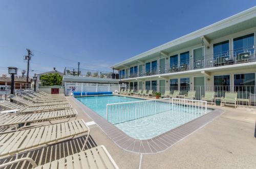 a swimming pool in front of a hotel at Marlane Motel in Wildwood